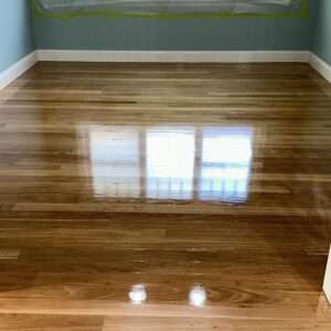 Residential timber floor sanding in progress in a Sydney living room