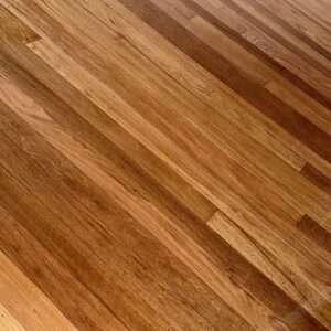 Floor sanding specialist using professional dustless equipment on hardwood timber floor in Sydney