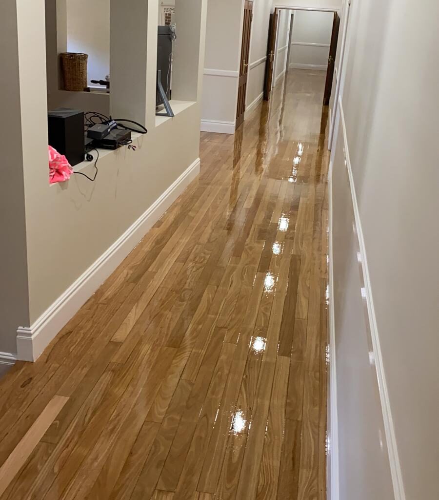 Restoring sun-faded timber floorboards in a Sydney home after UV damage